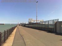 Looking along the length of the Prince of Wales Pier, the hoverport to the right and the Seacat gantry visible beyond the green fences